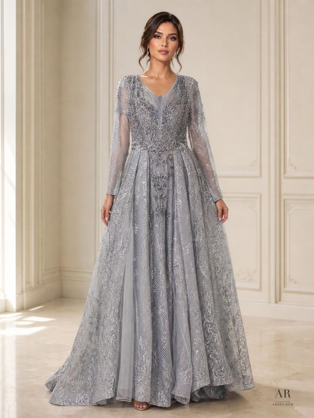 Evadne silver beaded illusion long sleeve a-line evening gown by Areen Row